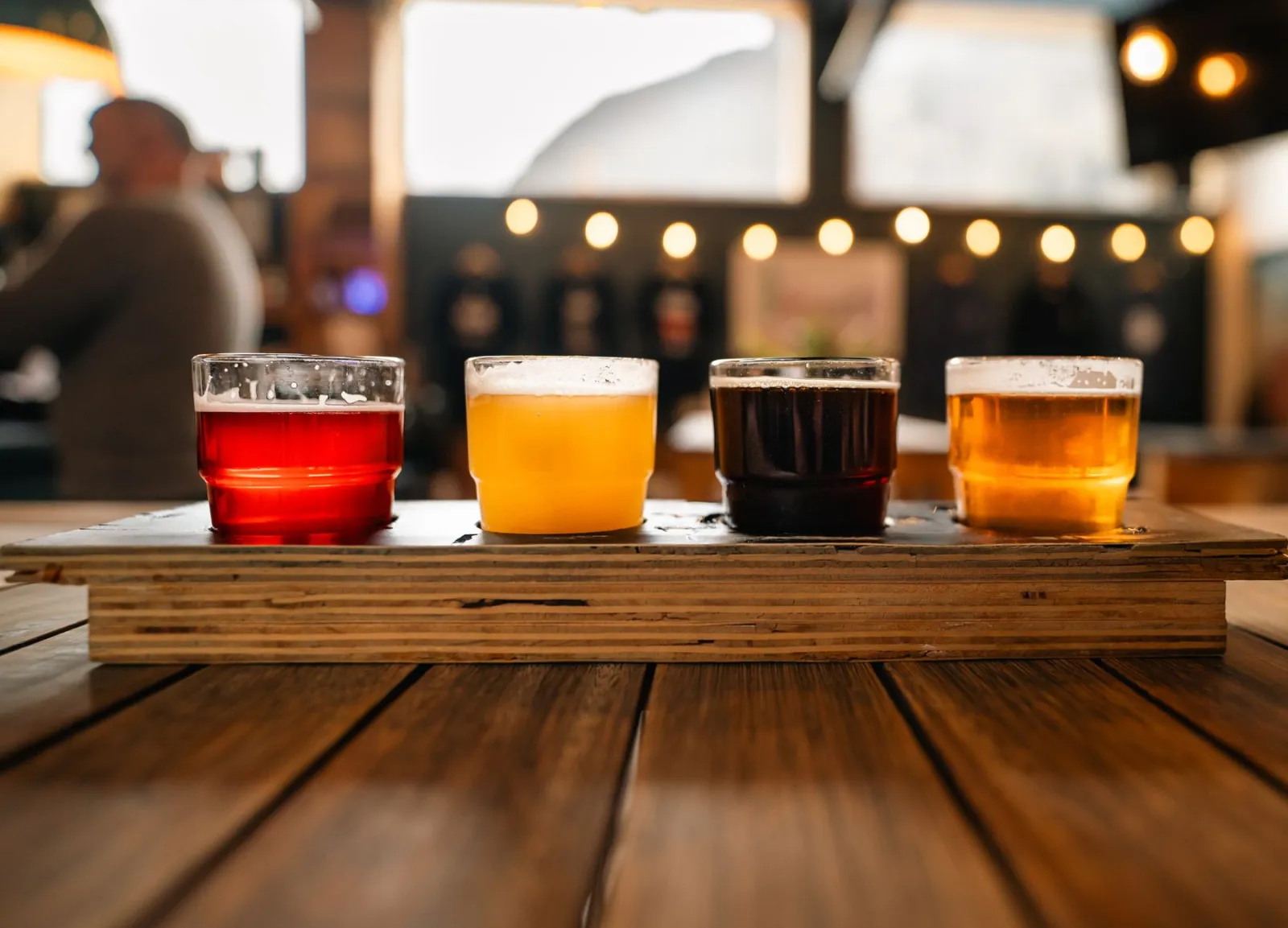 A selection of craft beers in a rustic pub, showcasing variety and ambiance.