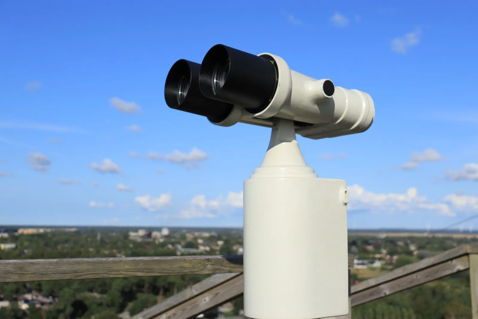 A public telescope offering a stunning daytime view of the city skyline.